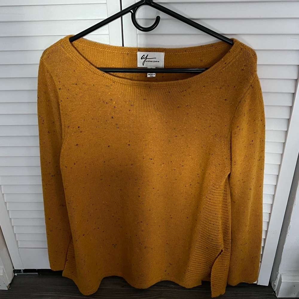 Cozy mustard yellow side slit knit sweater with specks of color